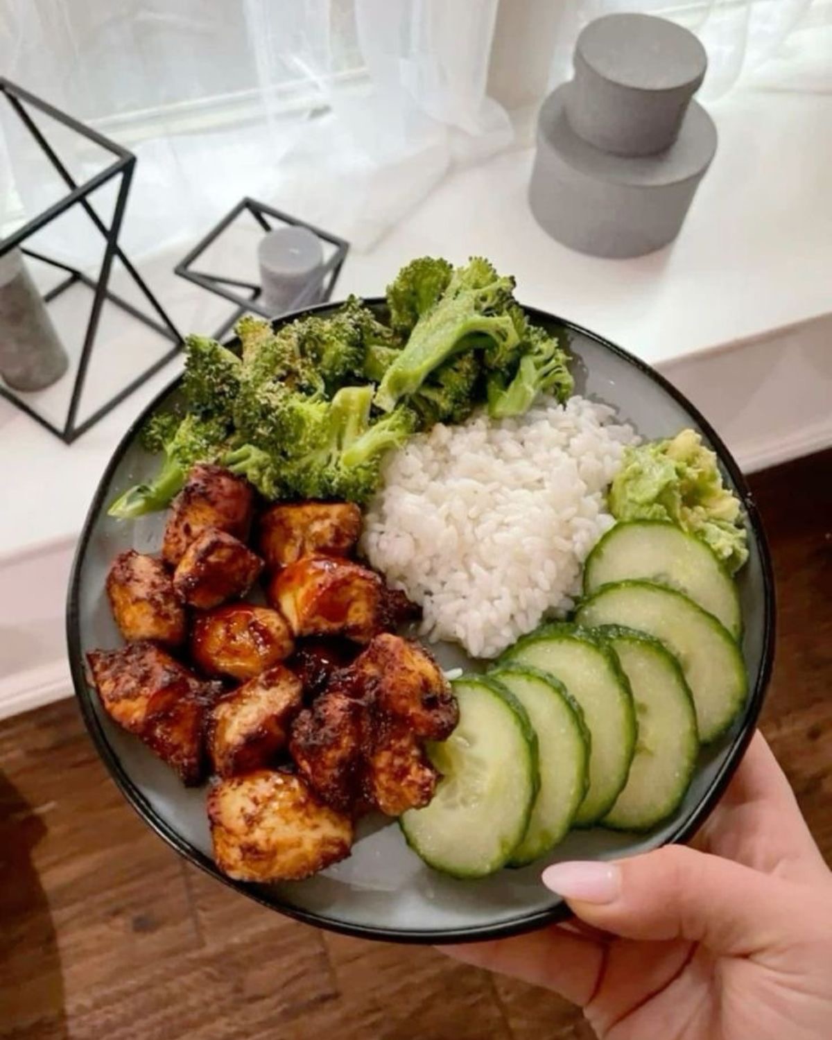Rice bowl with chicken, broccoli, and cucumber